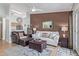 Inviting living room featuring a decorative ceiling fan, leather furniture, and stylish accents at 14203 N 19Th Ave # 2036, Phoenix, AZ 85023