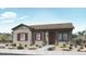 Charming single-story home featuring a neutral color palette, well-manicured landscaping, and inviting entryway at 14655 W Sand Hills Rd, Surprise, AZ 85388