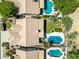 Bird's eye view of the home with lush landscaping, tile roof, and sparkling swimming pool at 14717 N 97Th Pl, Scottsdale, AZ 85260