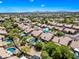 Aerial view of a desert community featuring homes with private pools and mountain views at 14717 N 97Th Pl, Scottsdale, AZ 85260