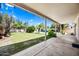 Expansive backyard with lush lawn, desert landscaping and a covered patio, creating a private oasis for outdoor enjoyment at 14717 N 97Th Pl, Scottsdale, AZ 85260
