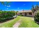 Lush backyard with well-manicured lawn, mature trees, and desert landscaping providing a tranquil outdoor setting at 14717 N 97Th Pl, Scottsdale, AZ 85260