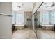 Spacious bathroom with double sinks, a glass shower, and natural light at 14717 N 97Th Pl, Scottsdale, AZ 85260