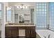 Bright bathroom featuring a soaking tub and double sink vanity at 14717 N 97Th Pl, Scottsdale, AZ 85260