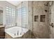 Elegant bathroom featuring a soaking tub and spacious walk-in shower at 14717 N 97Th Pl, Scottsdale, AZ 85260