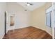 Bright bedroom with wood floors and large window at 14717 N 97Th Pl, Scottsdale, AZ 85260