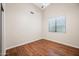Bedroom with wood flooring, neutral walls, and ample natural light at 14717 N 97Th Pl, Scottsdale, AZ 85260