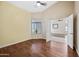 Bright bedroom with wood floors and large window at 14717 N 97Th Pl, Scottsdale, AZ 85260
