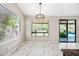 Bright dining area boasting an open floor plan and access to the backyard pool at 14717 N 97Th Pl, Scottsdale, AZ 85260