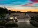 Charming single-story home with a tile roof, three-car garage, and desert landscaping set against a mountain backdrop at 14717 N 97Th Pl, Scottsdale, AZ 85260