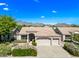 Beautiful single-story home with a tile roof, well-manicured lawn, and mountain views in a desert community at 14717 N 97Th Pl, Scottsdale, AZ 85260