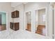 Hallway with a Butler Pantry with a countertop and brown cabinets at 14717 N 97Th Pl, Scottsdale, AZ 85260