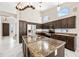 Gourmet kitchen featuring granite counters, kitchen island, stainless steel appliances, and custom cabinetry at 14717 N 97Th Pl, Scottsdale, AZ 85260