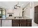 Gourmet kitchen featuring granite counters, kitchen island, stainless steel appliances, and custom cabinetry at 14717 N 97Th Pl, Scottsdale, AZ 85260