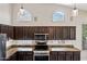 This spacious kitchen showcases custom cabinets, stainless steel appliances and granite countertops at 14717 N 97Th Pl, Scottsdale, AZ 85260