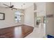 Bright open-concept living room featuring hardwood floors, vaulted ceilings, and modern light fixture at 14717 N 97Th Pl, Scottsdale, AZ 85260