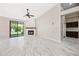 Bright living room with fireplace and patio access at 14717 N 97Th Pl, Scottsdale, AZ 85260