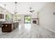 Open concept living space with kitchen, living room, and fireplace at 14717 N 97Th Pl, Scottsdale, AZ 85260