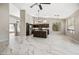 Expansive living space featuring dark wood cabinets, stone floors, and an open floor plan at 14717 N 97Th Pl, Scottsdale, AZ 85260