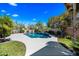 Sparkling pool with water feature and ample patio space, perfect for outdoor lounging and entertaining in the sunny backyard at 14717 N 97Th Pl, Scottsdale, AZ 85260