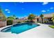 Beautiful pool surrounded by lush landscaping, offering a serene backyard retreat for relaxation and entertainment at 14717 N 97Th Pl, Scottsdale, AZ 85260