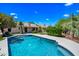 Inviting backyard featuring a sparkling pool and desert landscaping, creating a perfect oasis for relaxation and recreation at 14717 N 97Th Pl, Scottsdale, AZ 85260