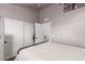 Neutral bedroom features white closets with doors, light-colored walls, and an open entry to another room at 1600 N Saba St # 143, Chandler, AZ 85225