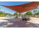Inviting community pool with ample seating and shade for relaxation at 1600 N Saba St # 143, Chandler, AZ 85225