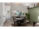 Stylish dining area next to open kitchen, with wood flooring and comfortable seating at 1600 N Saba St # 143, Chandler, AZ 85225