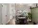 Stylish dining area next to open kitchen, with wood flooring and comfortable seating at 1600 N Saba St # 143, Chandler, AZ 85225