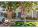 Charming townhouse entrance featuring a brick chimney and well-maintained front yard landscaping at 1600 N Saba St # 143, Chandler, AZ 85225