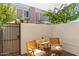 Cozy outdoor patio with seating and privacy wall offers a great space for relaxation at 1600 N Saba St # 143, Chandler, AZ 85225