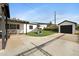 Backyard featuring turf, garage and play area at 1615 E Roma Ave, Phoenix, AZ 85016