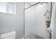 Modern bathroom featuring subway tile shower, shower caddy, and toilet at 1615 E Roma Ave, Phoenix, AZ 85016