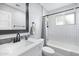 Updated bathroom with modern vanity, sleek fixtures, and subway tile shower for a fresh, clean aesthetic at 1615 E Roma Ave, Phoenix, AZ 85016