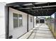 Covered carport area with access to the backyard and potential for additional parking at 1615 E Roma Ave, Phoenix, AZ 85016