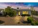 Charming single-story home showcasing desert landscaping and a cozy front porch at 1615 E Roma Ave, Phoenix, AZ 85016