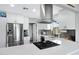 Bright kitchen boasts sleek countertops, stainless steel appliances, and updated fixtures for a modern feel at 1615 E Roma Ave, Phoenix, AZ 85016