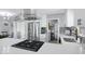 Updated kitchen features stainless steel appliances, a modern hood vent, and quartz countertops at 1615 E Roma Ave, Phoenix, AZ 85016