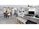 Open-concept living area featuring a kitchen, dining area, and comfortable living room setup at 1615 E Roma Ave, Phoenix, AZ 85016