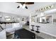 Open-concept living space with a modern kitchen, dining area, and comfortable living room at 1615 E Roma Ave, Phoenix, AZ 85016