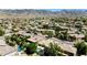 An aerial view shows the amazing surrounding mountains and desert landscape in this vibrant community of homes and lush landscaping at 1621 W Wildwood Dr, Phoenix, AZ 85045