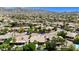 Community aerial view featuring gorgeous desert and mountain views plus mature landscaping, palm trees, and green grass at 1621 W Wildwood Dr, Phoenix, AZ 85045