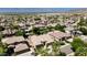 Community aerial view featuring lush landscaping, mature trees, beautiful green yards, and blue swimming pools at 1621 W Wildwood Dr, Phoenix, AZ 85045