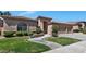 Charming single-story home featuring manicured landscaping, a tile roof, and a two-car garage at 1621 W Wildwood Dr, Phoenix, AZ 85045