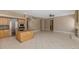 Kitchen area featuring tile flooring, a breakfast bar, stainless steel appliances and lots of open space at 1621 W Wildwood Dr, Phoenix, AZ 85045