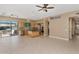 Open-concept kitchen and eating area with tile flooring, center island and stainless steel appliances at 1621 W Wildwood Dr, Phoenix, AZ 85045