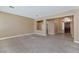 Spacious living room showcasing tile flooring leading up to a decorative wall and front entry way at 1621 W Wildwood Dr, Phoenix, AZ 85045