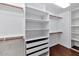 Well-organized walk-in closet with ample shelving and drawer space at 1621 W Wildwood Dr, Phoenix, AZ 85045