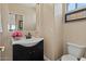 Stylish powder room with a modern vanity and elegant fixtures at 16420 N Thompson Peak Pkwy # 1002, Scottsdale, AZ 85260